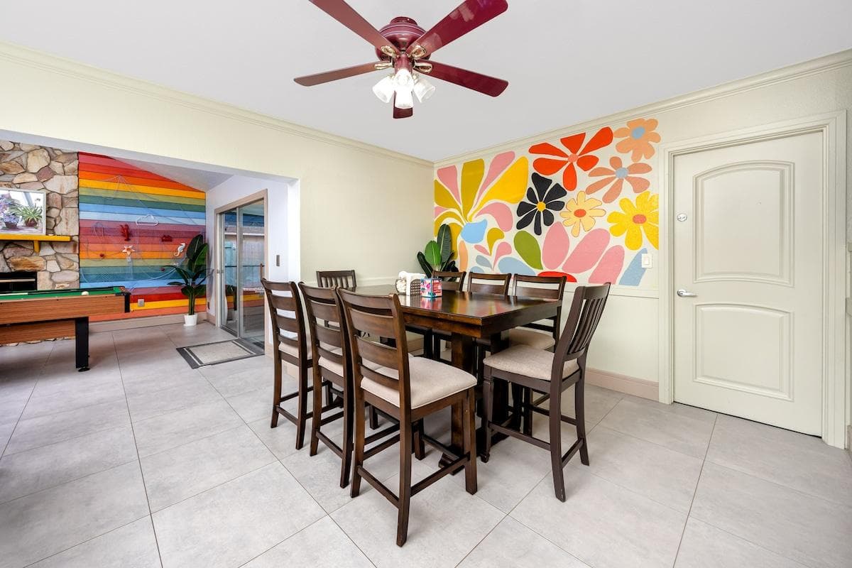 Our open-space design seamlessly connects the dining room with the game room, allowing you to enjoy meals without missing a moment of the game fun. Our dining area is set with a large table that accommodates up to eight guests comfortably