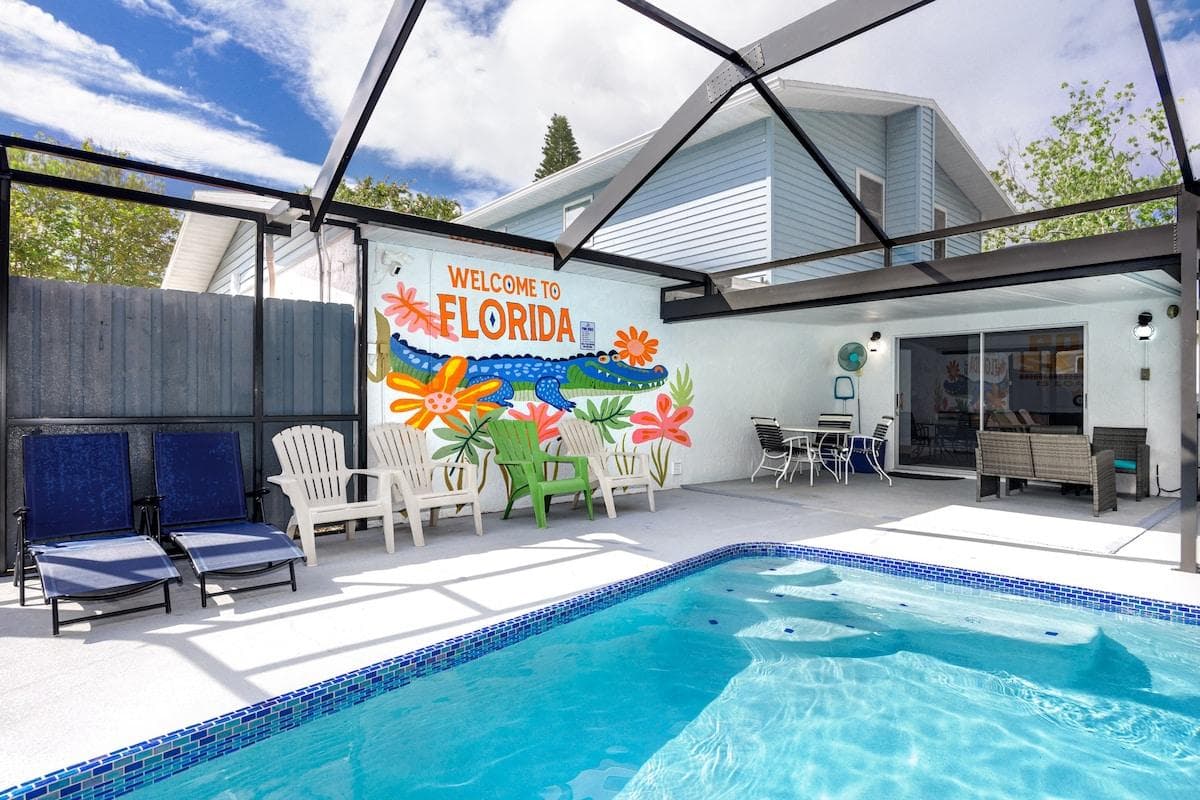 Indulge in our private heated pool under a sun and mosquito-protected screen dome, complete with a weather-protected patio. Unwind on lounges and Adirondack chairs, and capture a selfie with Florida’s iconic, vibrant mural! 