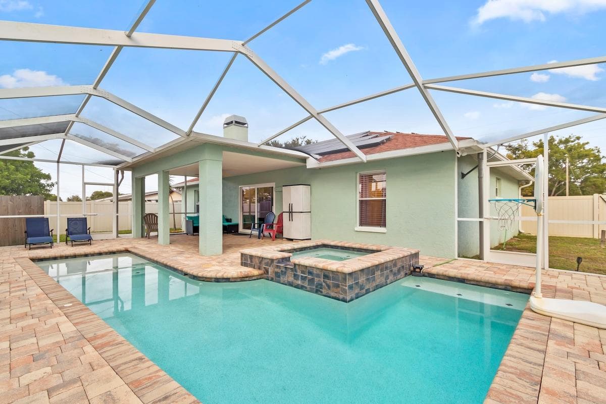 Enjoy a perfect escape under the screened pool cage: sun-safe, mosquito-free pool with spa, water basketball, and fun water play. Chill on stylish outdoor furniture, from Adirondack chairs to loungers!
